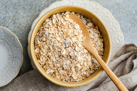 Close-up of a bowl of fresh organic raw oats ready to make porridge