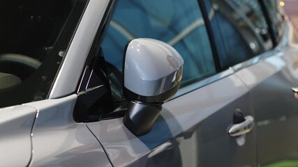 A businessman settles into a sleek, modern car, enjoying the experience. This moment reflects his discerning taste and the investment in a vehicle that complements his professional lifestyle.