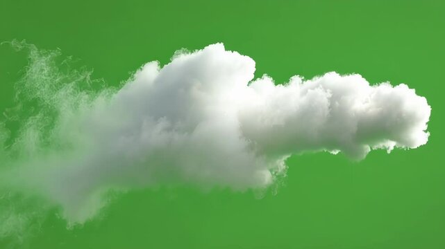 Solitary white cloud is slowly drifting on a chroma key green screen background, perfect for visual effects and compositing
