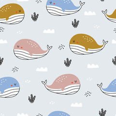 Cute, cartoon-style whales in various colors swim against a light blue background adorned with clouds and seaweed, creating a whimsical pattern.