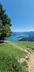 Obraz premium Zwölferhorn is a mountain located in the Salzkammergut region of Austria, near Lake Wolfgang (Wolfgangsee). It is a popular destination for outdoor activities such as hiking, skiing, and paragliding. 