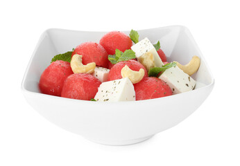 Delicious watermelon salad with feta cheese, cashew nuts and spices in bowl isolated on white