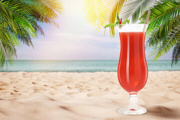 Summer beach with delicious cocktail, palm trees and golden sand, space for text