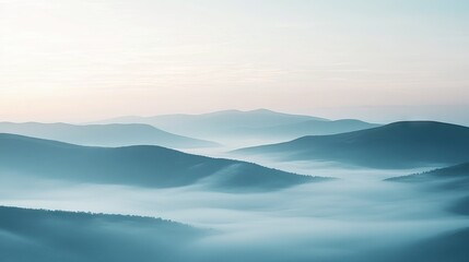 Obraz premium A tranquil landscape covered in a thick sea of fog with rolling hills in the distance, providing ample open space for text.