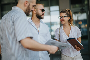 Fototapeta premium Team of marketing workers having an outdoor meeting, engaged in discussing campaign performance, market trends, and strategy development.