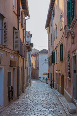 Fototapeta premium Wandering through the charming cobblestone streets of Rovinj, Croatia during golden hour