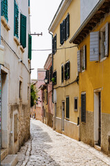 Obraz premium Charming cobblestone streets of Rovinj, Croatia, inviting exploration on a sunny afternoon