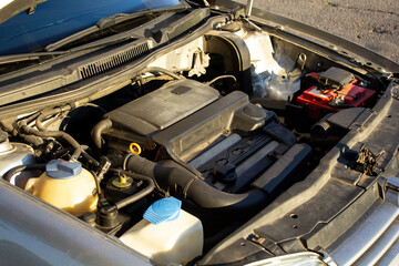 car maintenance. open car hood, change oil, antifreeze, oil filter, air filter and timing belt. Car breakdown