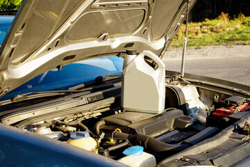 changing the oil in a car engine. Regular vehicle maintenance.