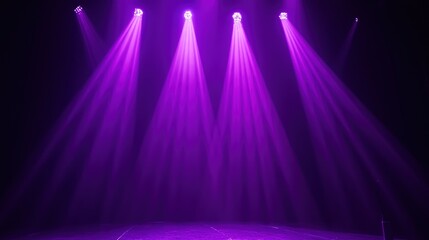 Purple stage lights casting beams in a dark setting, ready for a performance.