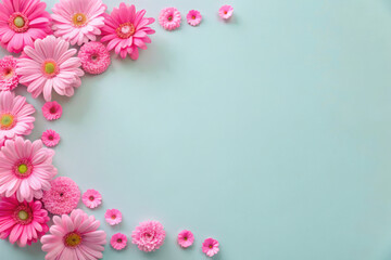Fototapeta premium Delicate pink flowers gracefully arranged on a soft blue background, creating a serene and vibrant floral display in spring. Generative AI