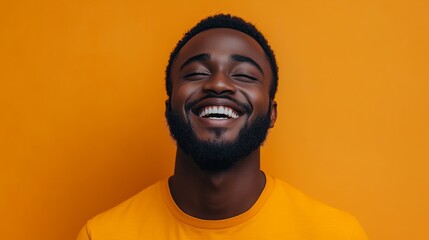 Obraz premium Portrait of a happy handsome man in a shirt with laughing