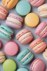 Obraz premium Colorful macarons arranged elegantly on a light background during a dessert showcase