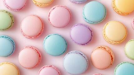 Obraz premium Colorful macarons arranged beautifully on a pastel background for a delightful dessert display