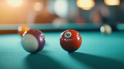 Billiard balls on a green felt table during a game in a lively bar setting