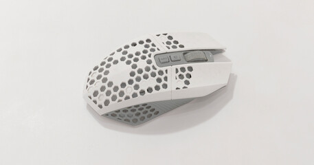 Modern lightweight gaming mouse with honeycomb shell design, optimized for performance and comfort, in minimalist style.