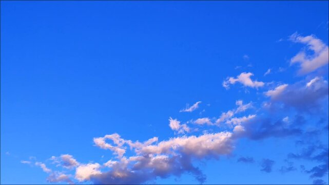 Pink, white and blue cumulus clouds timelapse abstract background