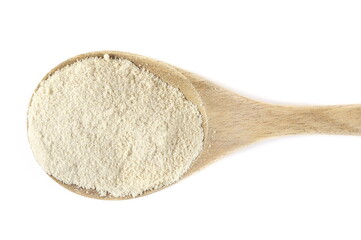 Sesame flour in wooden spoon isolated on white, top view