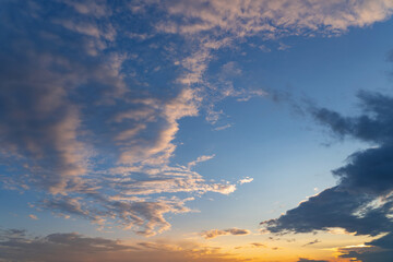 summer evening, sunset in yellow, orange and pink with clouds, background