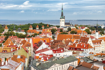 Aerial panorama of downtown of Tallinn with Saint Olaf`s church and the sea, Estonia 