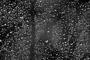 raindrops on window on car windshield	
