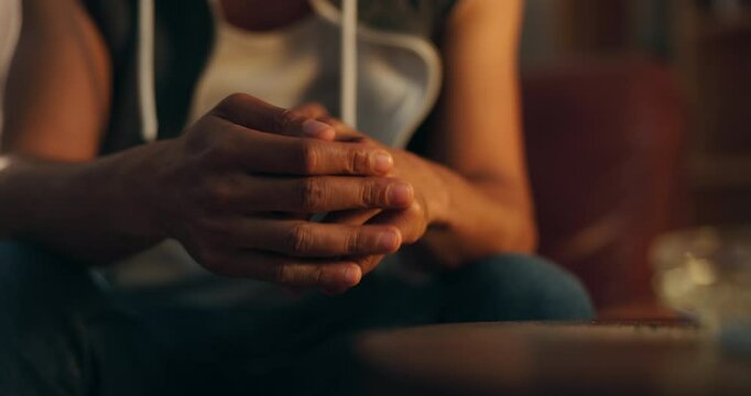 Anxiety, drug addict and hands of person in home with stress, worry and withdrawal symptoms. Mental health, substance abuse and closeup of gesture for rehabilitation, recovery or addiction at night