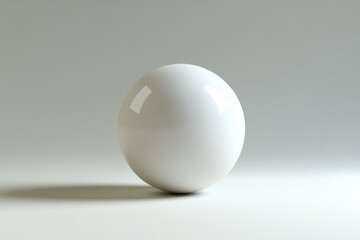 A Single, Smooth, White Sphere on a Light Grey Surface