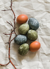 Easter eggs painted in natural shades on a light background