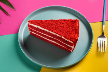 Red Velvet Cake Slice on Colorful Background Sweet Indulgence and Festive Treat