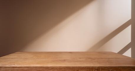 Wooden countertop in the kitchen. Empty product table against a beige wall background. Brown