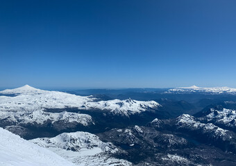 View from the top of Lanin Volcano over the Andes Mountain Range in winter time with lots of snow.