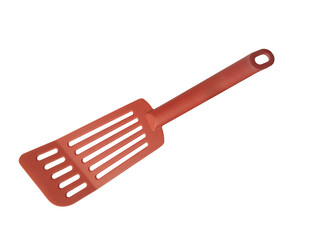 a red plastic kitchen spatula