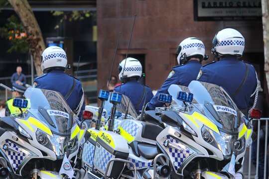 Sydney, NSW Australia - April 25 2021: Anzac Day March. NSW motorbike policemen beside their bikes