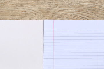 Naklejka premium Blank Notebook on Wooden Table for Creativity