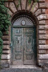 Interesting door on a building in Rome, Italy.