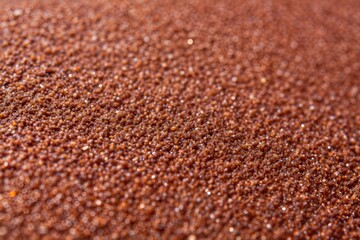 Close-up of brown granular surface with rough texture