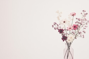 A Delicate Bouquet of Pink and White Flowers in a Glass Vase