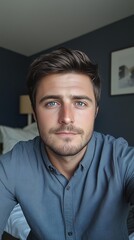 Obraz premium Selfie of a charismatic 35-year-old man in his bedroom, with a calm and thoughtful expression, capturing a natural and personal moment