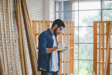 Carpenter working in carpentry shop. Carpenter working to making wood furniture in wood workshop