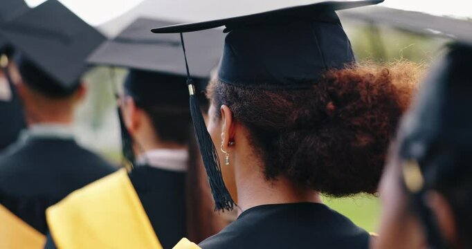Woman, group and graduation outdoor on campus with tassel breeze, diploma ceremony and achievement, Back, graduate and students with cap on university field for education milestone and celebration