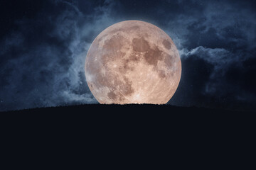 Big amazing full moon with grass and starry sky with clouds. Halloween creative © alones