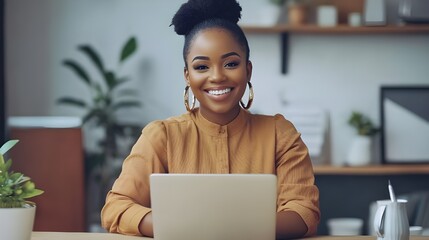 Joyful young woman participating in a virtual meeting, highlighting remote work and a diverse, inclusive workplace culture.