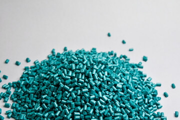 pearl turquoise masterbatch granules on a white background, this polymer is a product coloring...