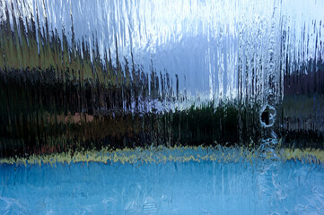 A fountain designed to resemble a waterfall, serving as a decorative feature for a family swimming pool