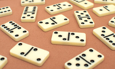 Dominoes bones on brown background	