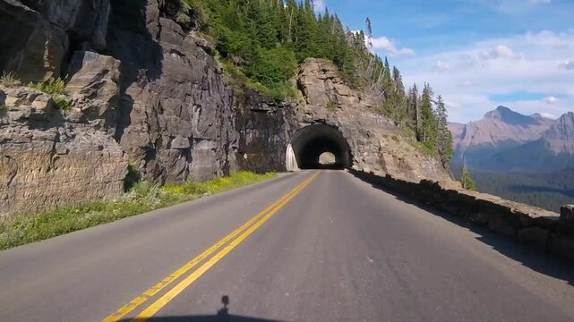 Driving through east tunnel on Going To The Sun Road in Glacier National Park, Montana, USA