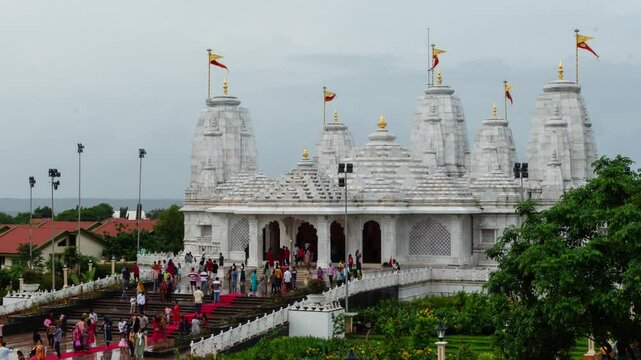 Hyper lapse time lapse footage of Birla Radha Krishna Mandir during the day where devotees families and tourists visit the newly opened temple in Vasco Goa