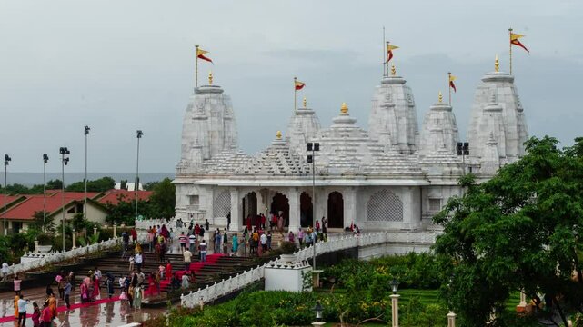 Hyper lapse time lapse footage of Birla Radha Krishna Mandir during the day where devotees families and tourists visit the newly opened temple in Vasco Goa