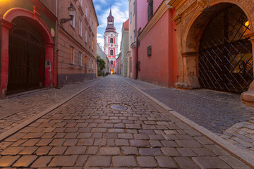 Cobbled Street Leading to Church at Sunset in Poznan, Poland