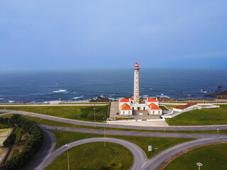 View of lighthouse Portuguese, with nice details and very particular framing, blue sky as background, located in Le&ccedil;a da Palmeira, Porto, Portugal. Matosinhos. Le&ccedil;a Beach. Drone. Aerial view